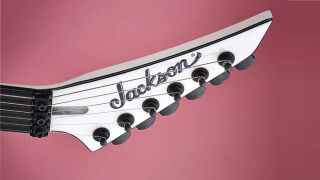 Jackson guitars headstock on pink background