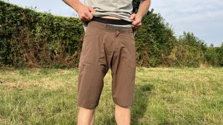 7mesh Glidepath shorts being worn in a field