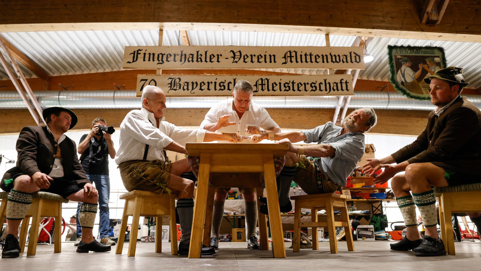 
                                Two men compete in the 70th Bavarian finger wrestling championship in Mittenwald, Germany
                            