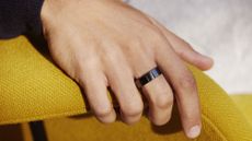 Oura smart ring wearable on a man's finger