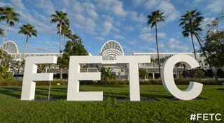 Letters spelling out F-E-T-C on lawn 