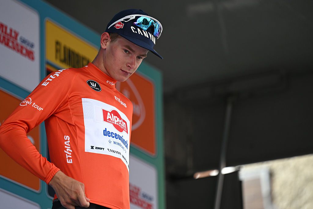 GERAARDSBERGEN, BELGIUM - AUGUST 22: Tibor Del Grosso of Netherlands and Team Alpedin - Deceuninck celebrates at podium as Red Best Young Rider Jersey winner during the 20th Renewi Tour 2025, Stage 3 a 181.8km stage from Aalter to Geraardsbergen / #UCIWT / on August 22, 2025 in Geraardsbergen, Belgium. (Photo by Luc Claessen/Getty Images)