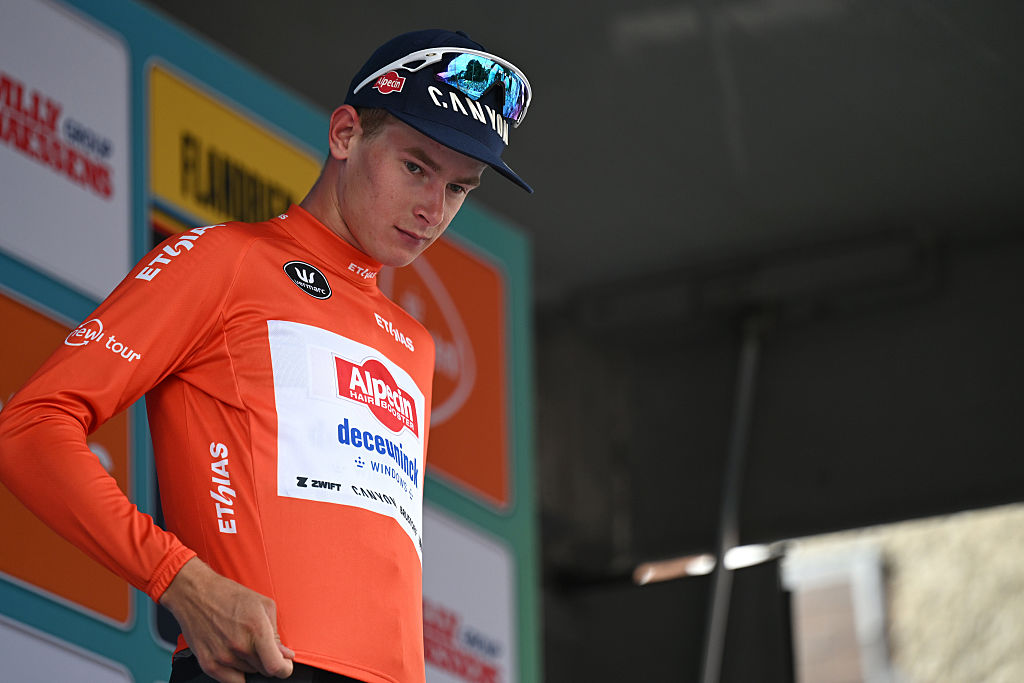 GERAARDSBERGEN, BELGIUM - AUGUST 22: Tibor Del Grosso of Netherlands and Team Alpedin - Deceuninck celebrates at podium as Red Best Young Rider Jersey winner during the 20th Renewi Tour 2025, Stage 3 a 181.8km stage from Aalter to Geraardsbergen / #UCIWT / on August 22, 2025 in Geraardsbergen, Belgium. (Photo by Luc Claessen/Getty Images)