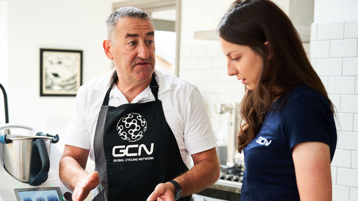 Nigel Mitchell and cyclist Manon Lloyd in a kitchen