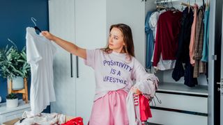 Woman sorting out her wardrobe