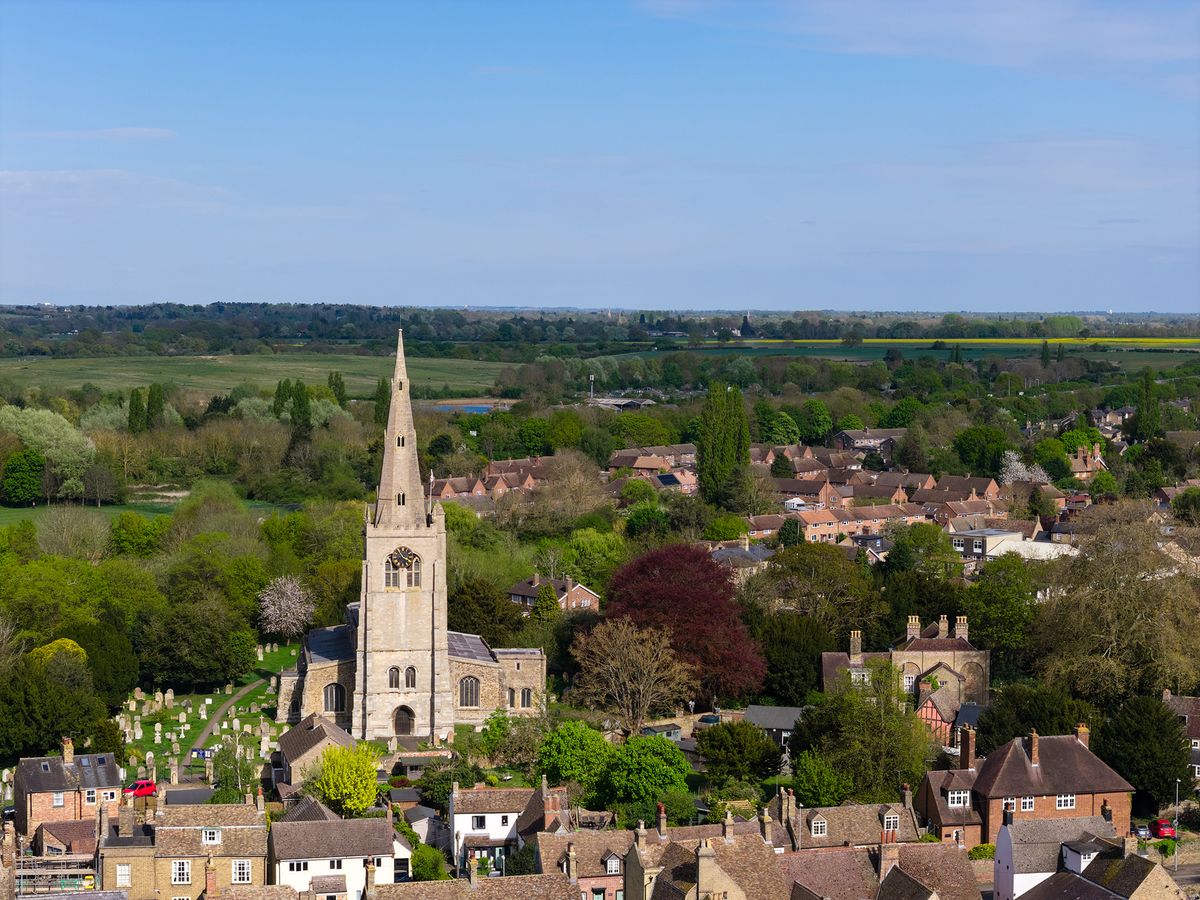 Aerial photograph of UK church towering above a town