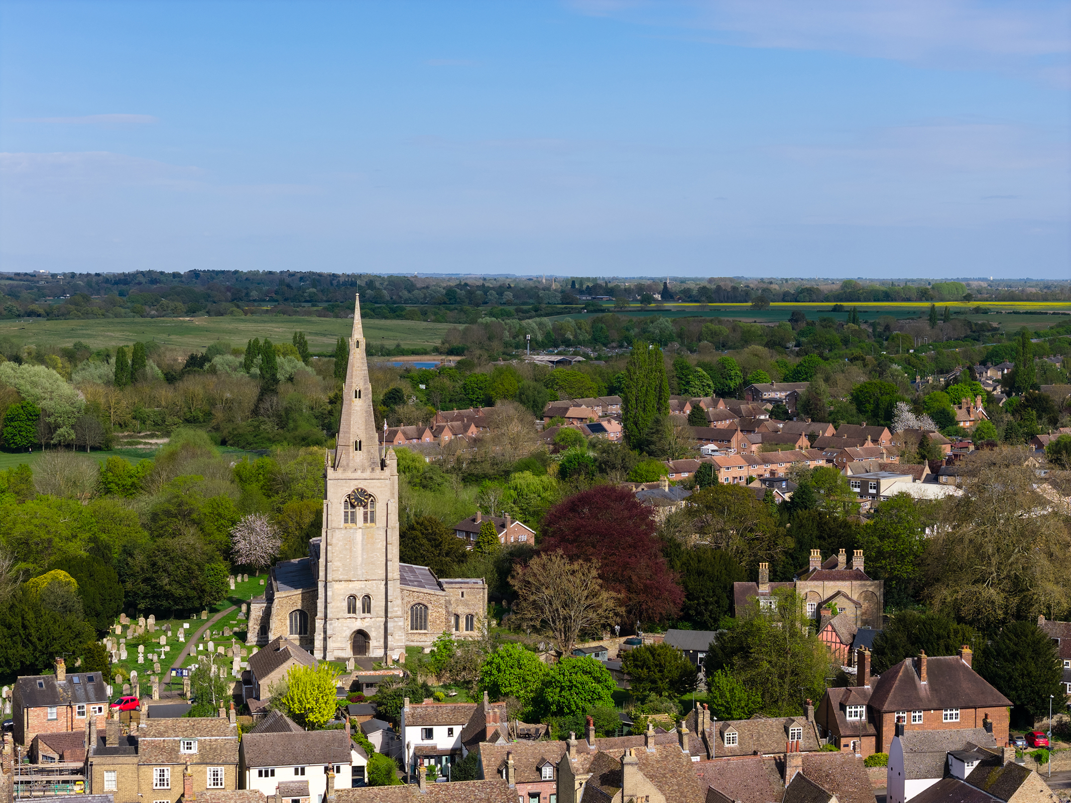 Aerial photograph of UK church towering above a town
