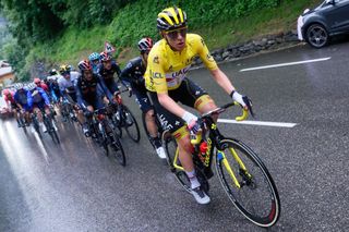 Team UAE Emirates Tadej Pogacar of Slovenia wearing the overall leaders yellow jersey leads the pack during the 9th stage of the 108th edition of the Tour de France cycling race 144 km between Cluses and Tignes on July 04 2021 Photo by Thomas SAMSON AFP Photo by THOMAS SAMSONAFP via Getty Images