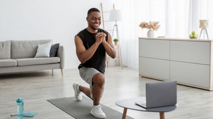 Man performing a lunge at home