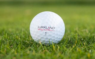 Kirkland Signature 3-Piece Urethane Cover 2.0 Golf Balls resting on the fairway
