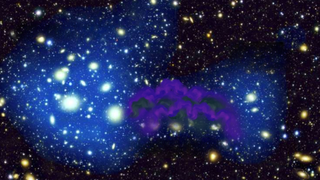 An illustration shows a "dark matter bridge" stretching between two colliding galaxies
