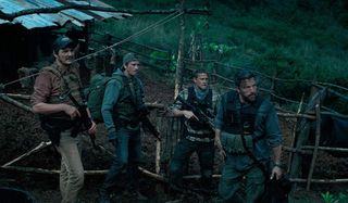 Triple Frontier Pedro Pascal Garrett Hedlund Charlie Hunnam Ben Affleck armed in the jungle, looking