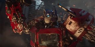Optimus Prime charging into battle on Cybertron
