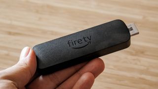 Amazon Fire TV Stick 4K Select held in hand