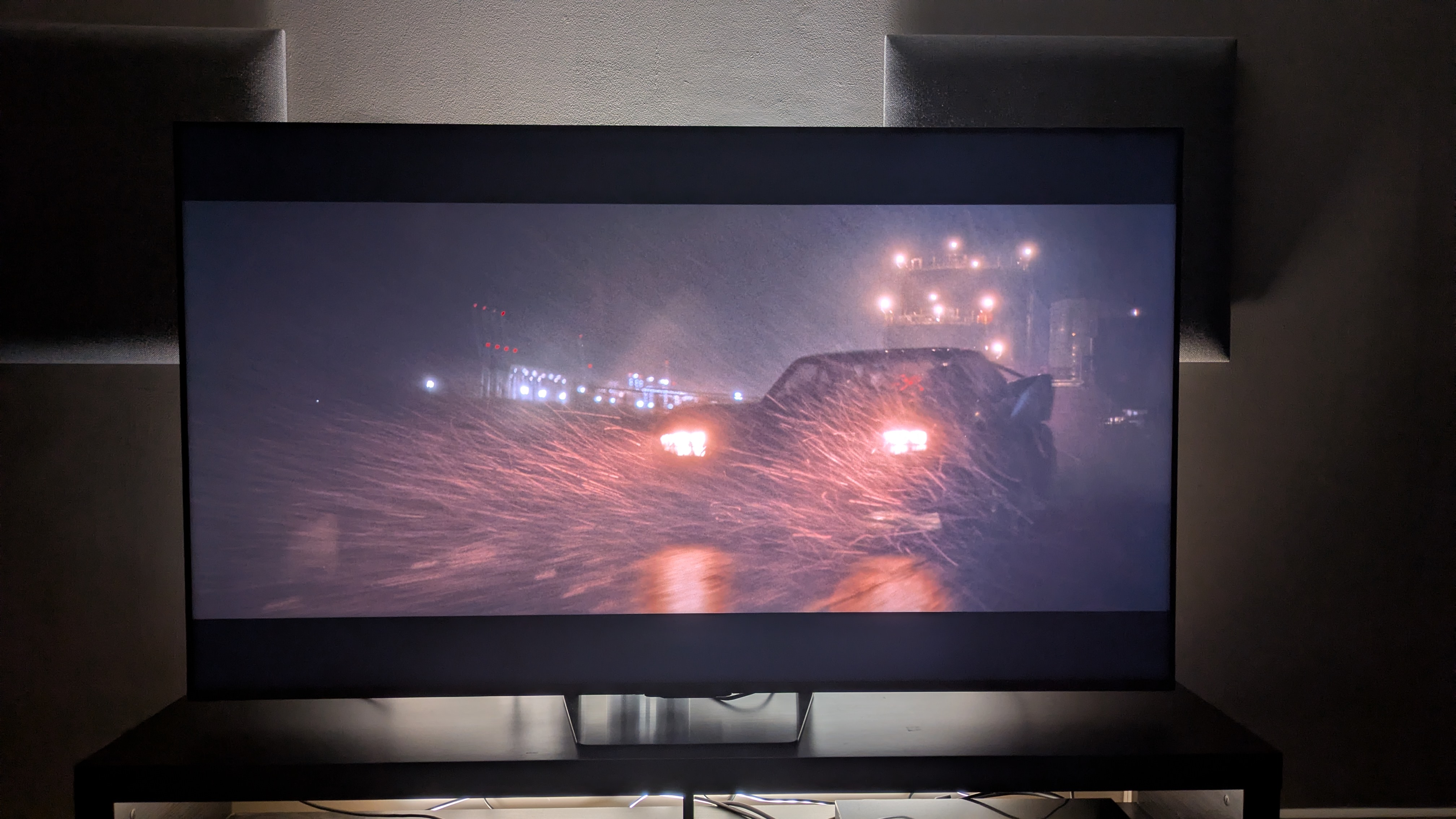 Hisense UR8 showing the Batmobile from The Batman on screen.