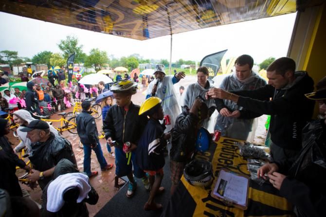 Riders hand out the race numbers