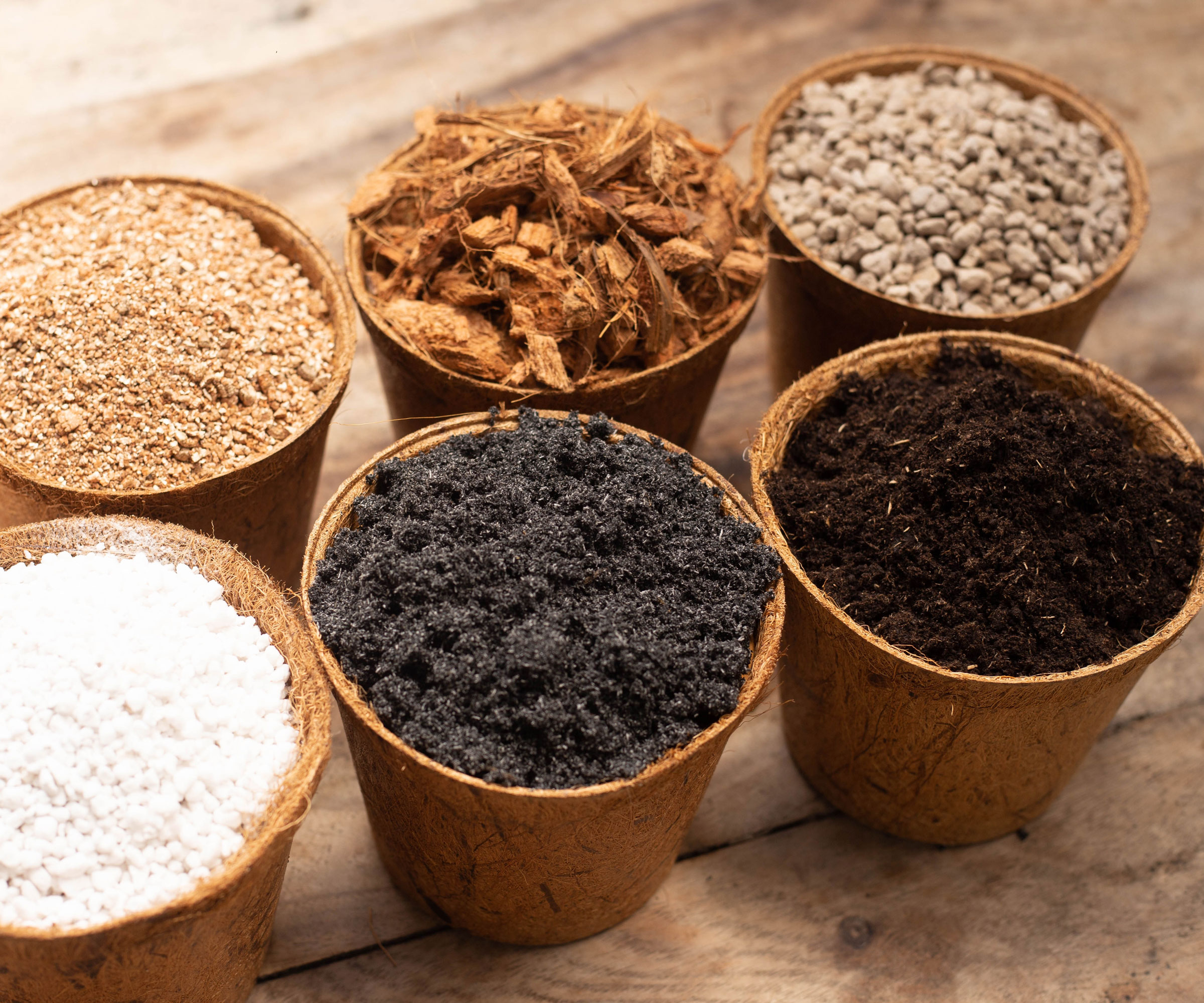 potting soil with worm castings and vermiculite and other soil amendments in pots