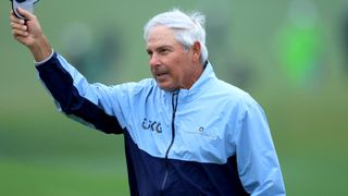 Fred Couples raises his hat to the crowd after making the cut at the 2023 Masters