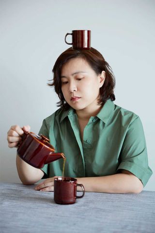 chinese artist Cao Fei drinking tea