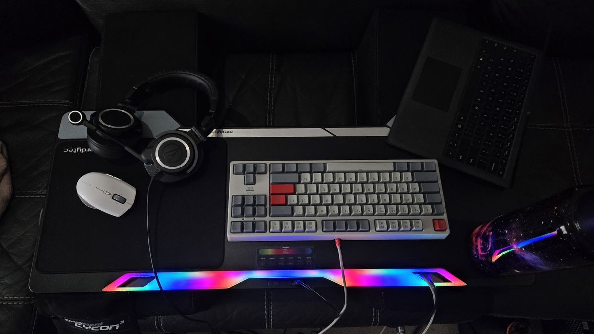 Couchmaster Cycon3 set-up on a sofa with a keyboard and mouse.