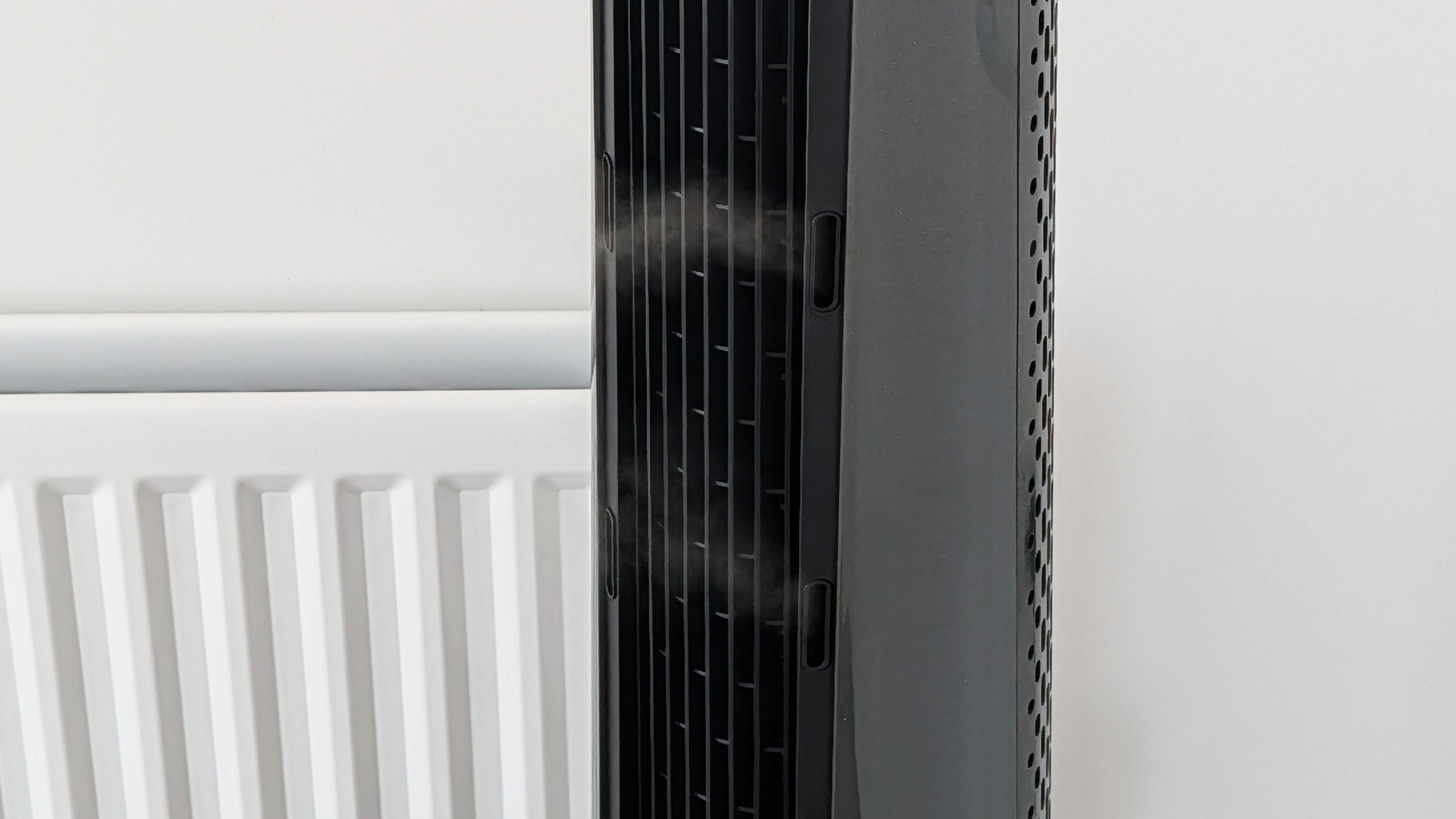 The front grille of the Dreo Smart Misting Fan 765S, with a tiny hint of mist just visible.