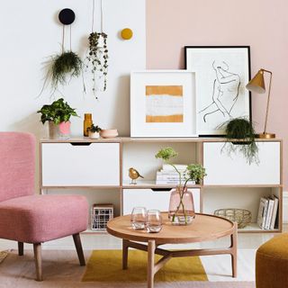 Living room styled with pink and wood accents
