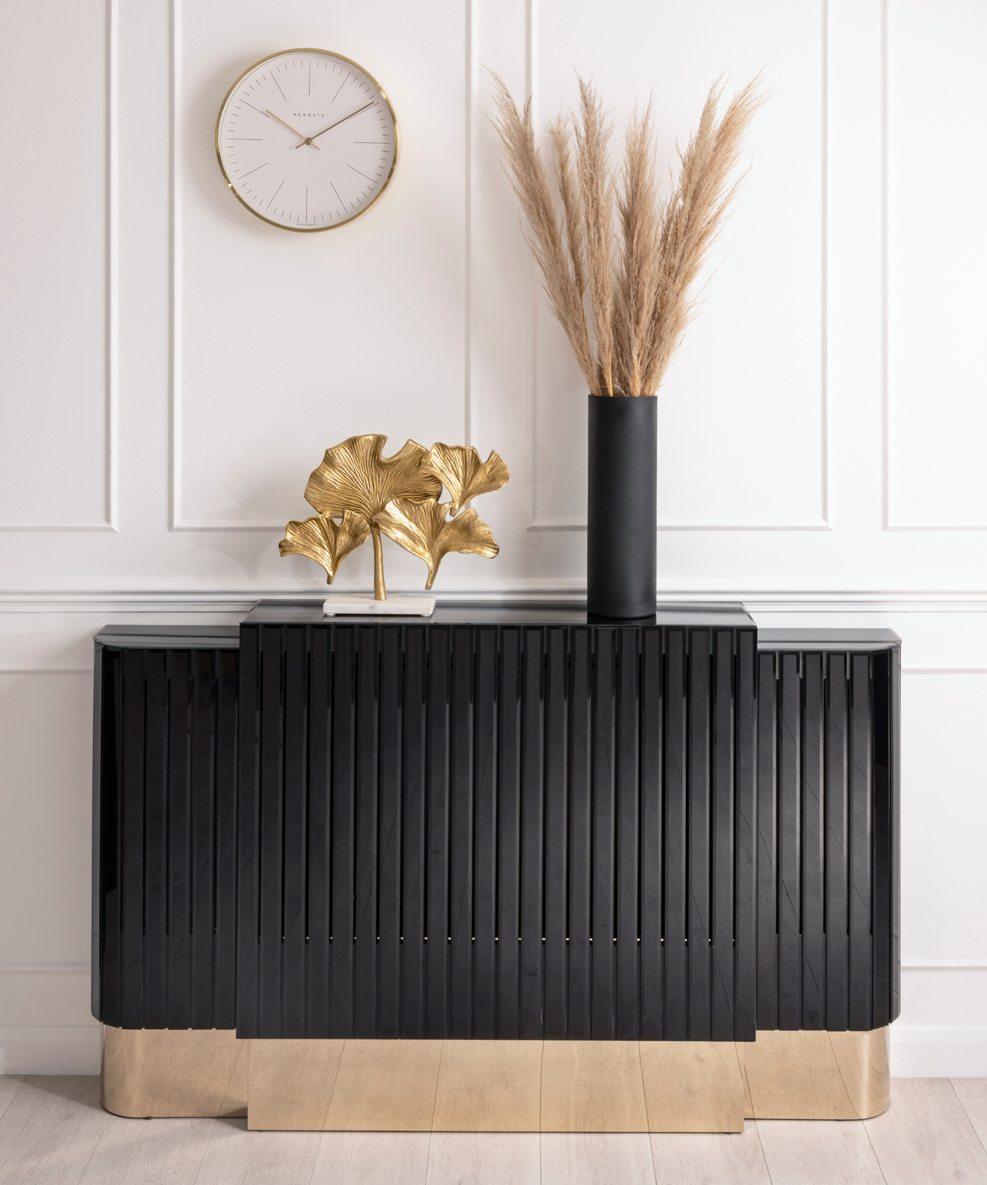 black and gold detailed radiator cover on rad with white panelled wall behind