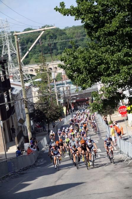 The peloton heads into the Manayunk Wall