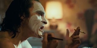 Joaquin Phoenix Arthur Fleck Joker applying makeup