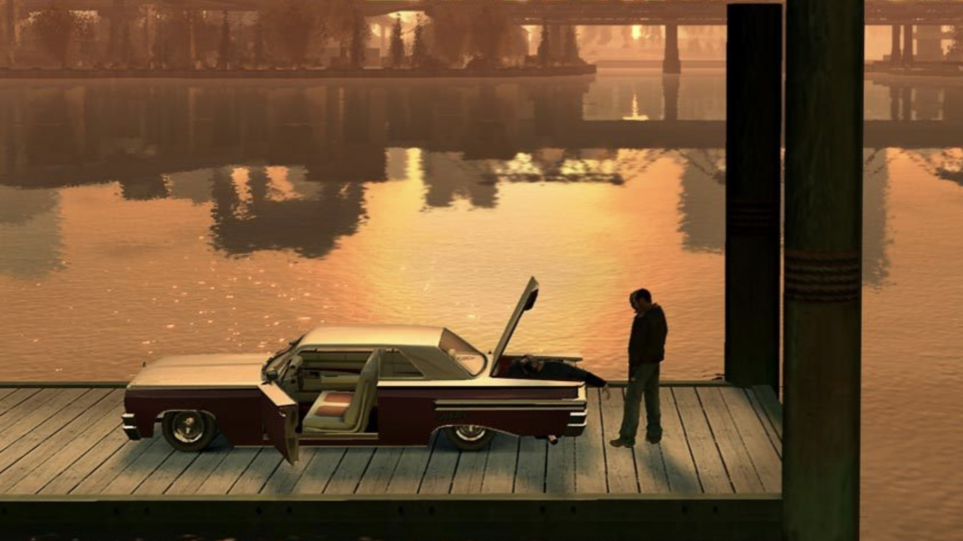 Niko stands on a dock looking into the trunk of a red and white car