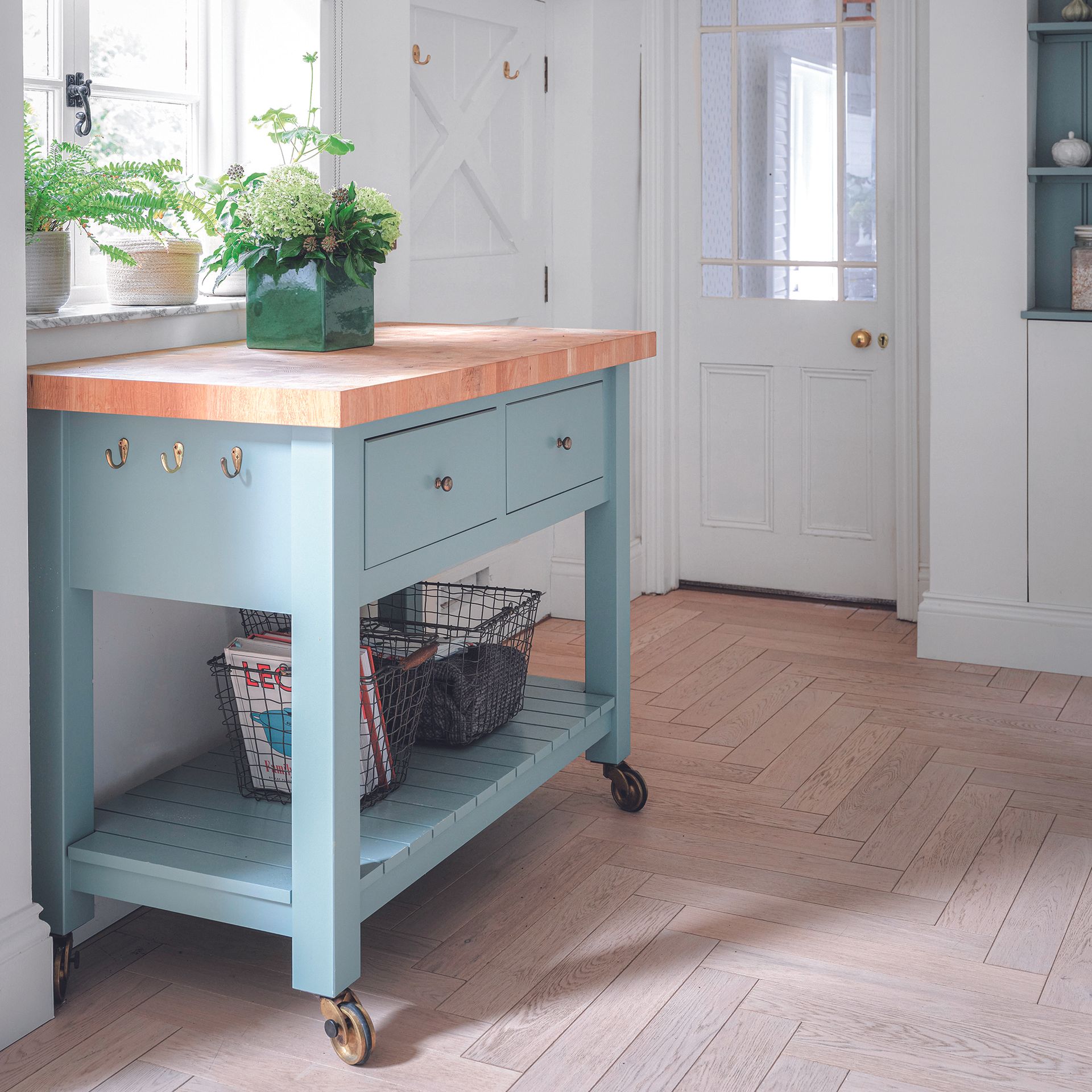 Kitchen with IKEA kitchen island painted in blue