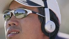 Golfer wearing headphones