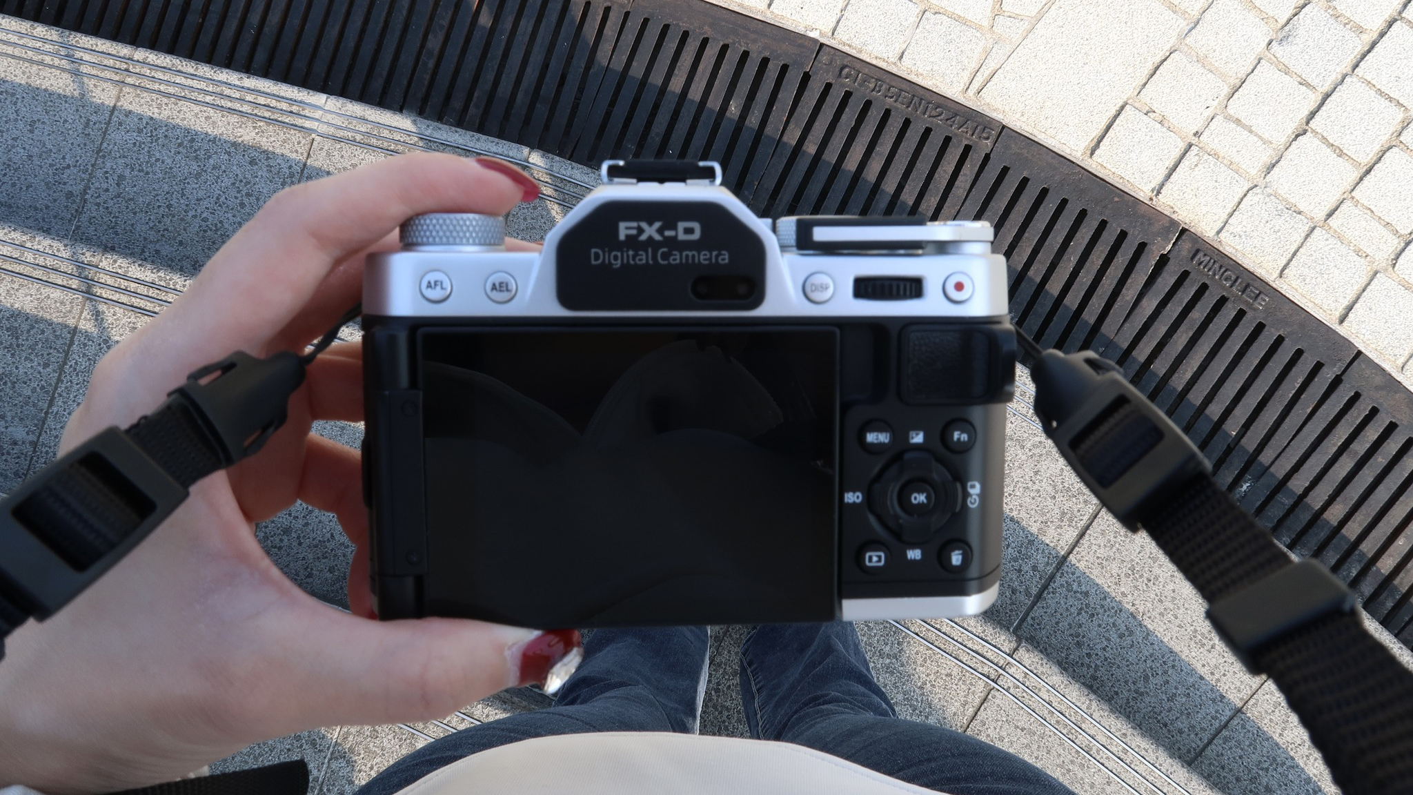 The Yashica FX-D held in a person's hands