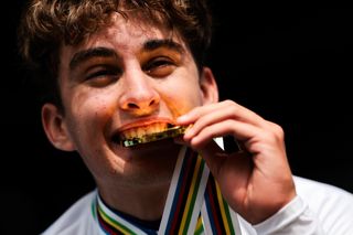 Picture by Alex Whitehead/SWpix.com - 23/09/2024 - 2024 UCI Road and Para-cycling Road World Championships, Zurich, Switzerland - Menâ€™s Junior Individual Time Trial (ITT) Podium - Paul Seixas (France) on the podium receiving the Gold Medal to become World Champion