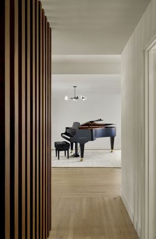 A passageway with maple wood flooring