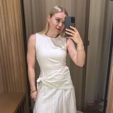 Woman wears white dress with handkerchief lace scarf