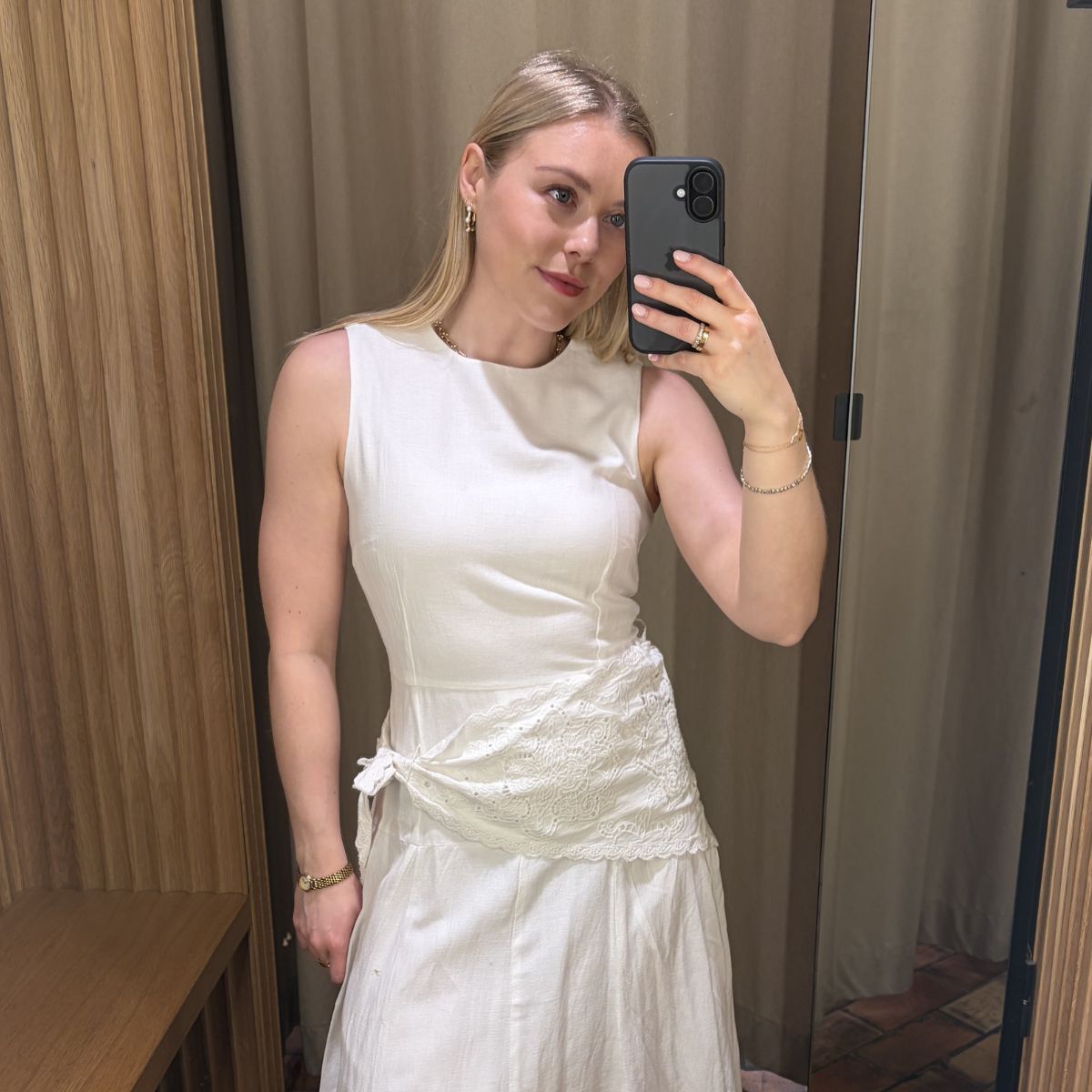 Woman wears white dress with handkerchief lace scarf