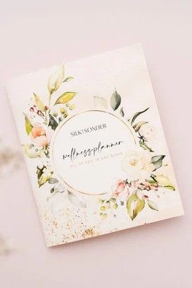pale pink planner with flowers on it