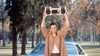 John Cusack as Lloyd Dobler, holding up a boombox in Say Anything