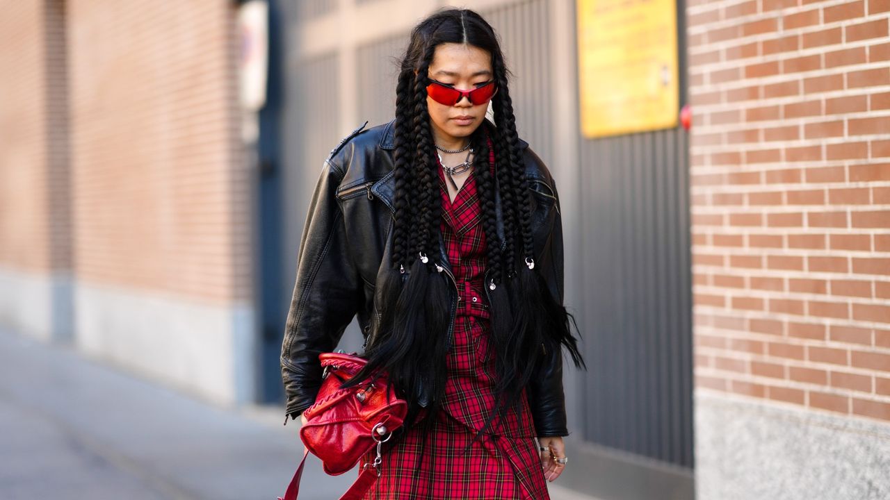 girl wearing plaid red dress and leather dress