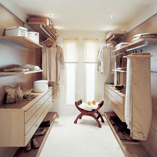 wardrobe with white wall wooden shelf and white flooring