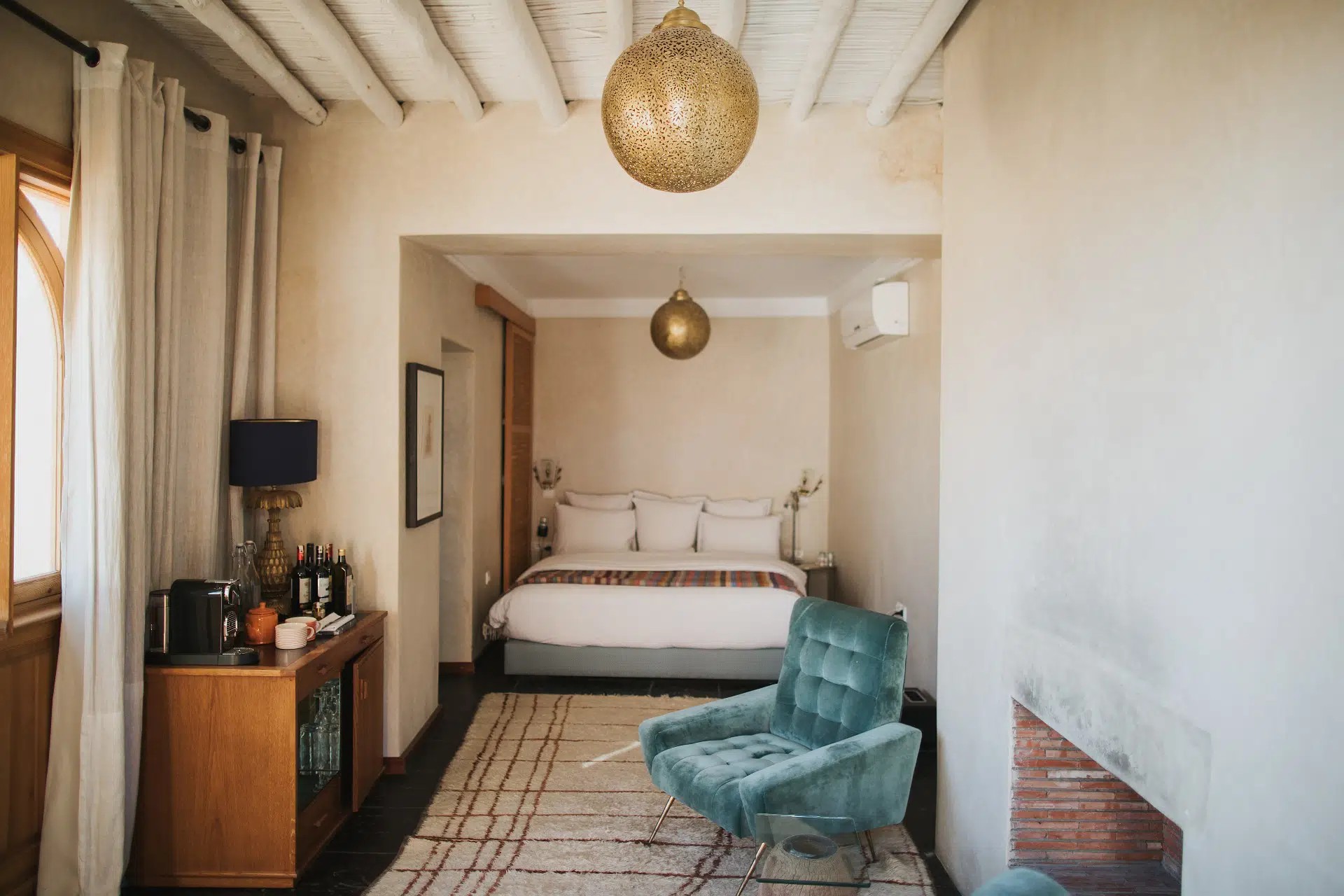 A colorful Moroccan riad has been transformed into a kaleidoscope of patterned textiles, striking artwork, and eye-catching tiles.