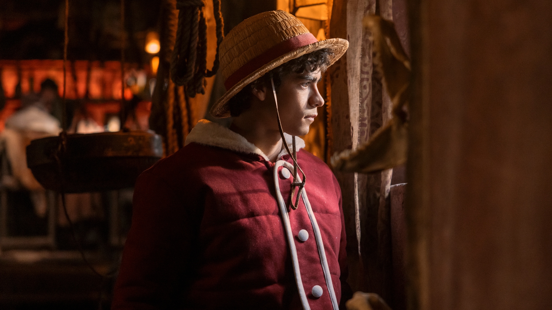 Monkey D. Luffy looks out a window in One Piece season 2