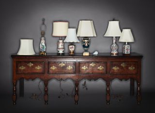 Rockefeller collection A selection of lamps atop an English oak dresser