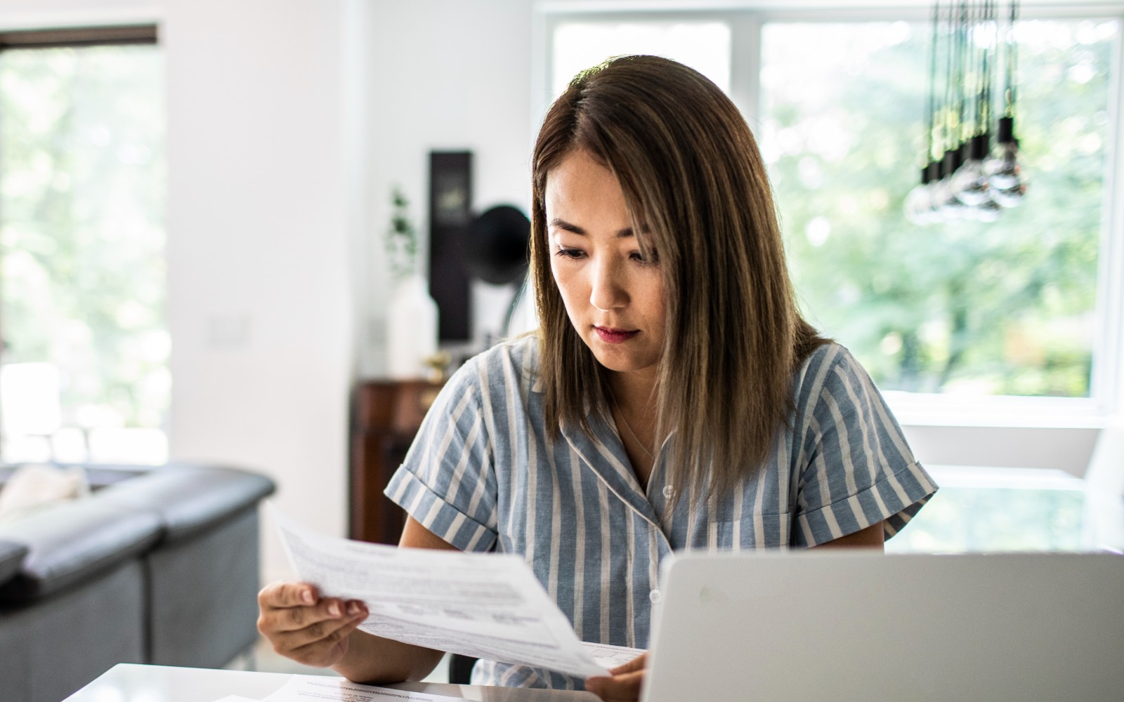 Woman reading paperwork