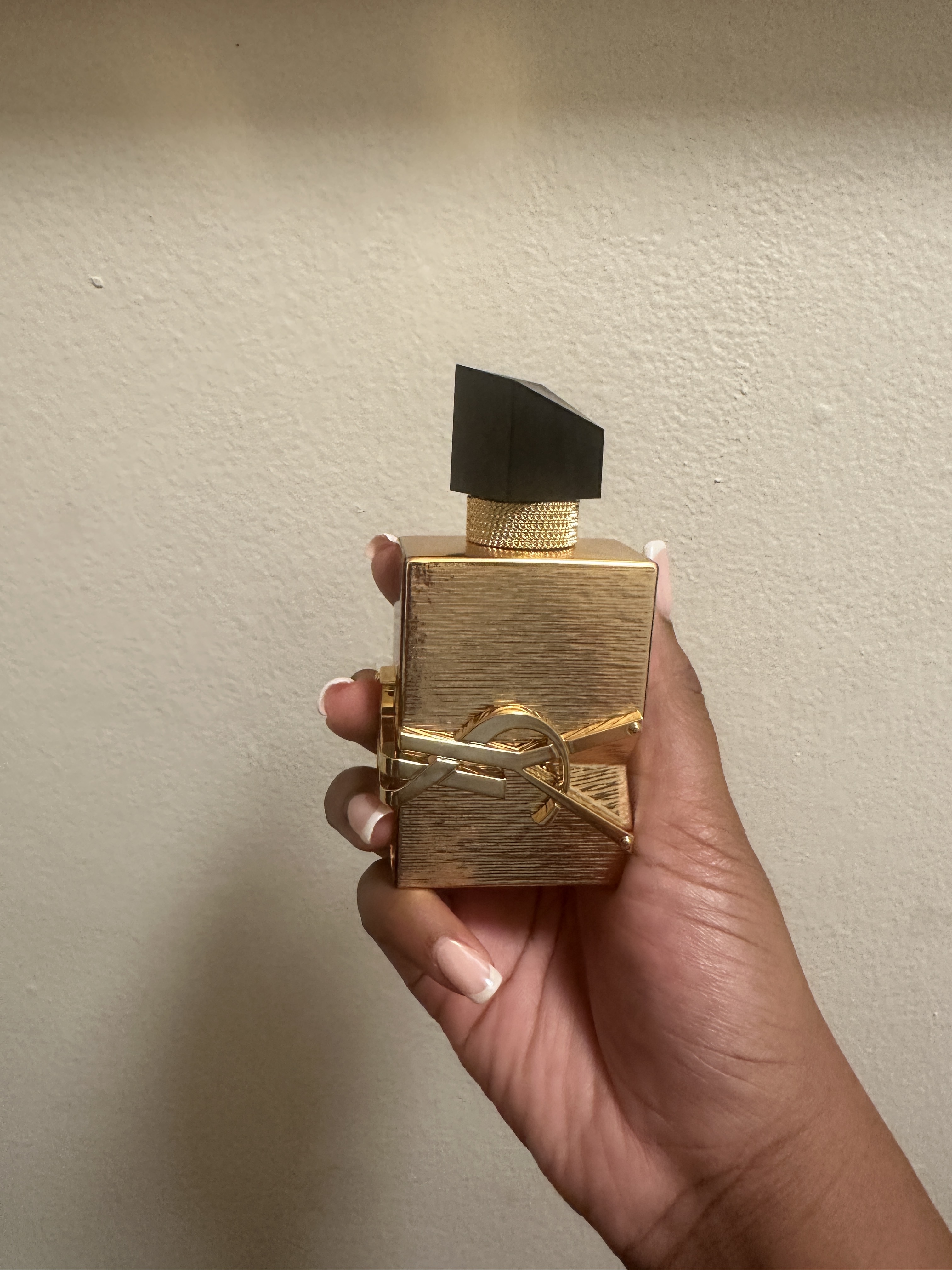 Ariel Baker testing YSL Libre Perfume.