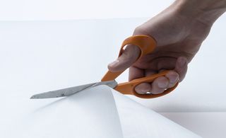 Image of cutting fabric