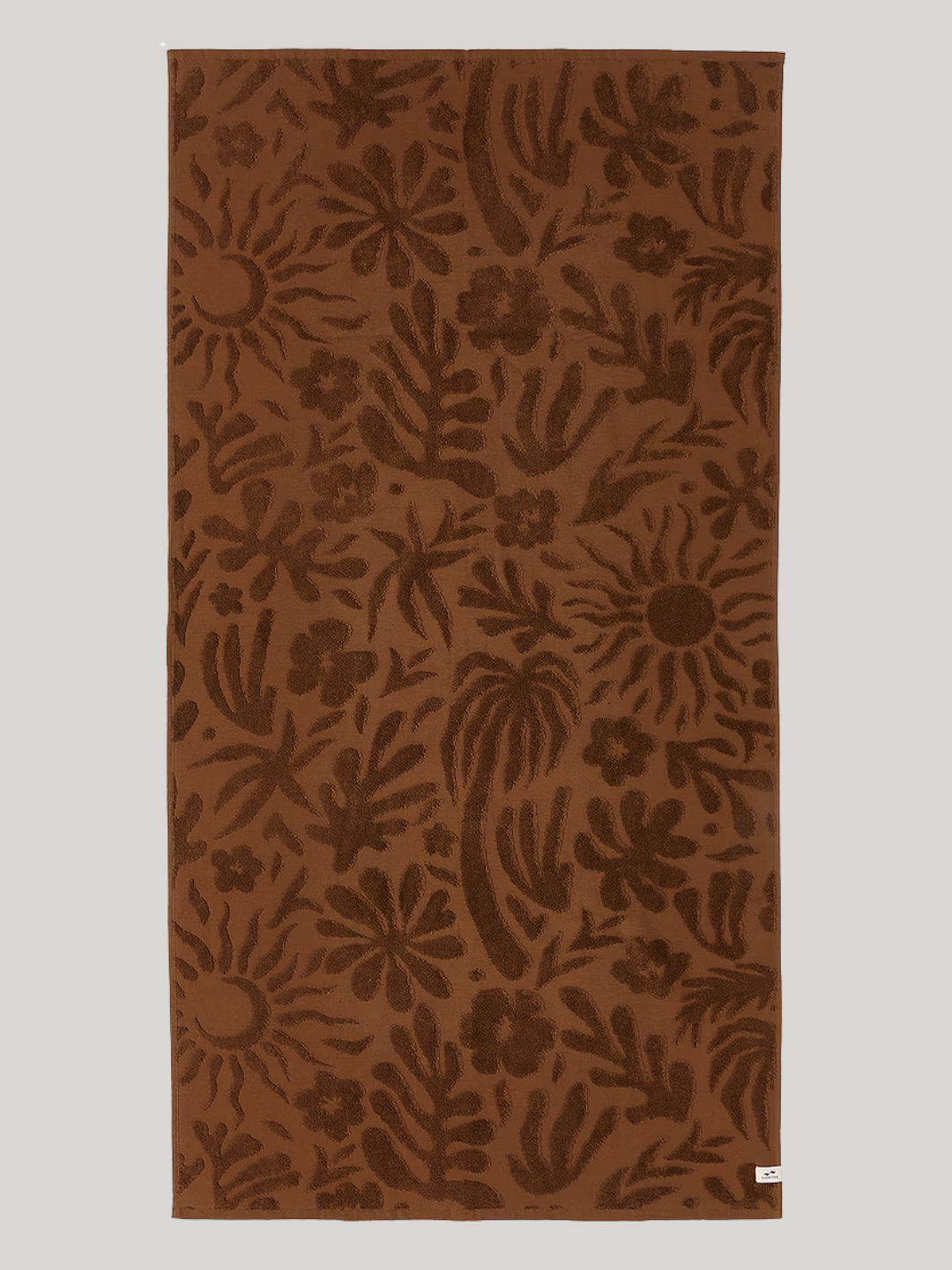 A brown tufted bath towel from Slowtide