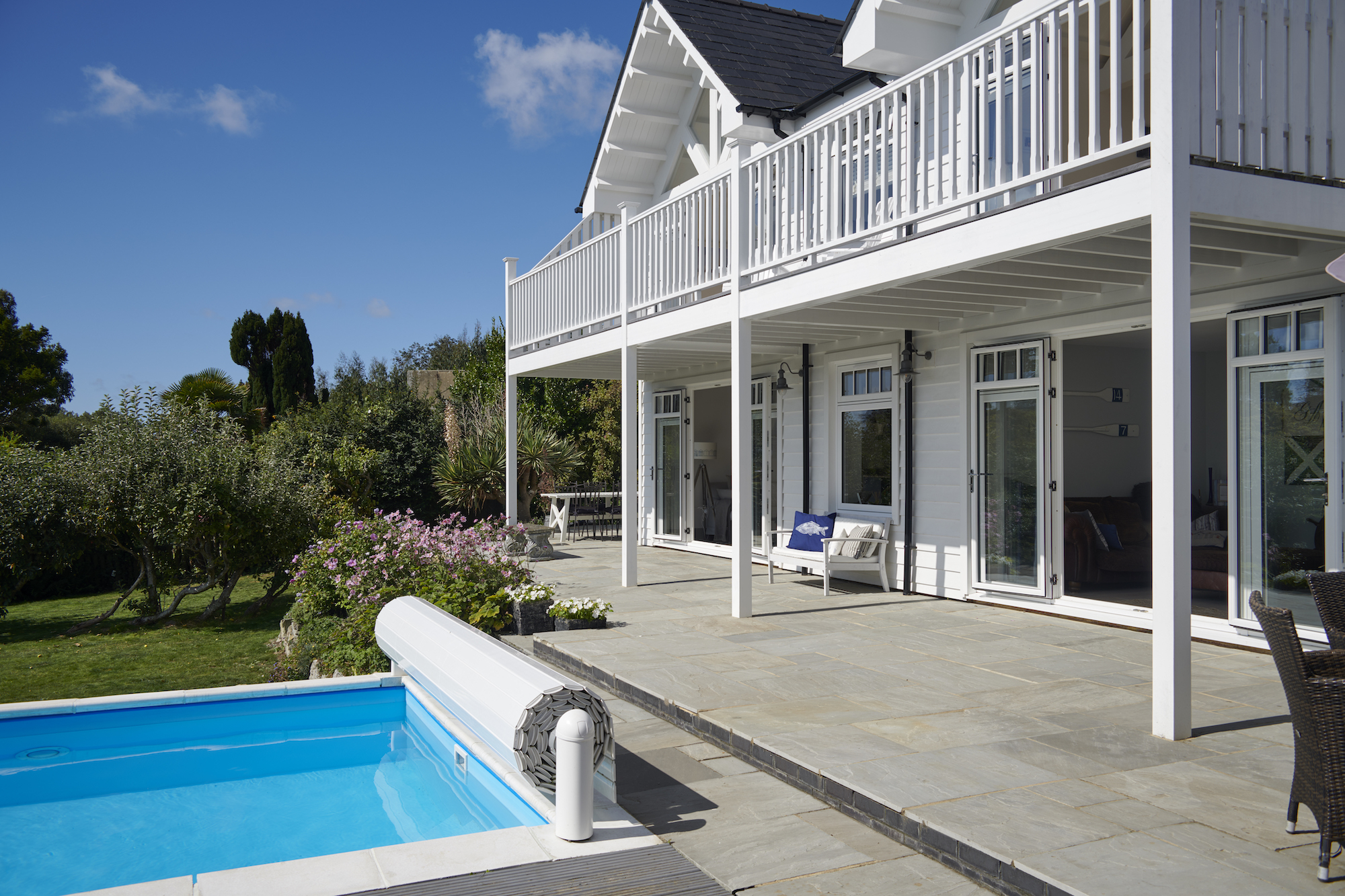 new england style house with swimming pool