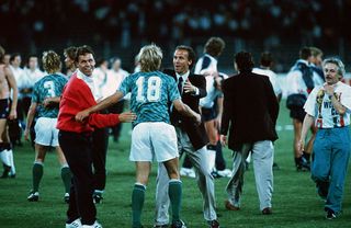 Germany with head coach Franz Beckenbauer (R), Juergen Klinsmann (C) and Holger Osiek celebrates after winning the World Cup semi final match between England and Germany at the Delle Alpi Stadium on July 4, 1990 in Turin, Italy.